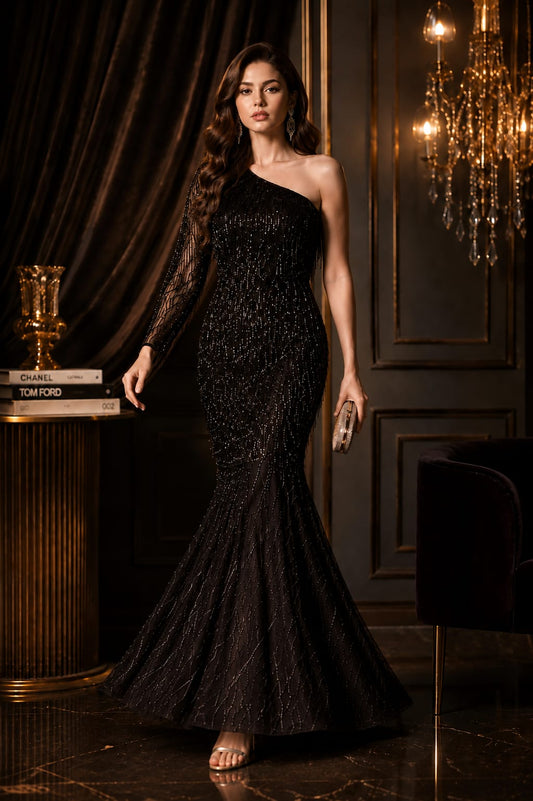 Black one shoulder net and velvet gown.