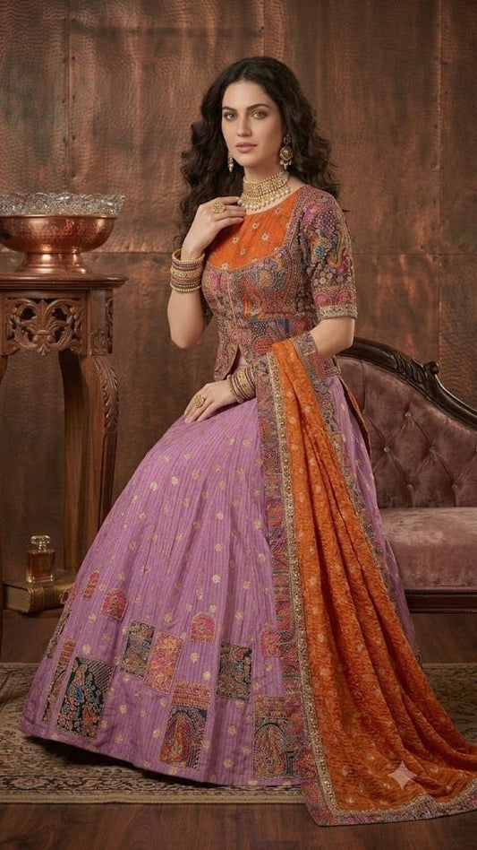 Lilac ghaghra and purple ready embroidery brocade choli with orange dupatta.